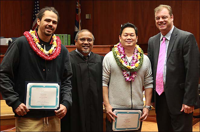 District Court Judge William Domingo (second from left) is joined by DUI defense attorney and DWI Court Committee Member R. Patrick McPherson (far right) to congratulate the DWI Court’s 18th and 19th graduates.