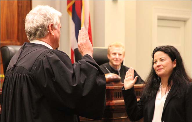 Chief Justice Recktenwald administers the Oath of Office to Dyan M. Medeiros.  
