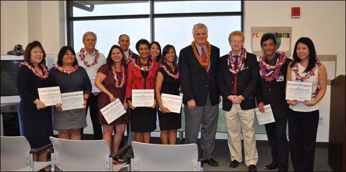 Chief Justice Mark Recktenwald and Senior Family Court Judge R. Mark Browning (fourth and third from the right) thanked  the Family Law attorneys volunteering to staff the Access to Justice Room.  The attorneys who attended the ceremony are,  from left: Dyan Mitsuyama, Carol Tribbey, Richard Diehl, Jackie Thurston, Seth Harris, Marianita Lopez, Mari Kishimoto,  Elsa McGehee, Steve Hartley and Elizabeth Paek.