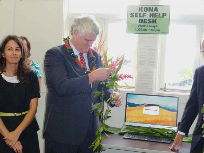 Chief Justice Mark Recktenwald untied the maile lei officially launching the new self-help desk at the Kona courthouse.