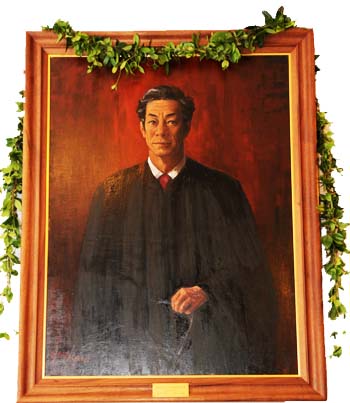 Portrait of Chief Justice William S. Richardson draped with a lei