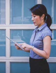 photo of lady on her using a tablet device