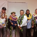 Hilo Drug Court Judge Greg Nakamura stands in the center of a group of six Big Island Drug Court graduates, all wearing leis, May19, 2016.