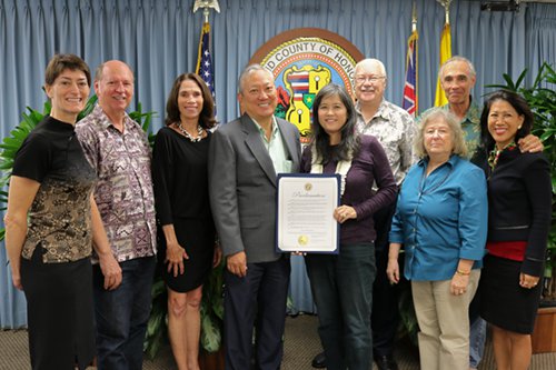 City & County of Honolulu Managing Director Roy Amemiya, Jr. with proclamation surrounded by 8 alternative dispute resolution practitioners.