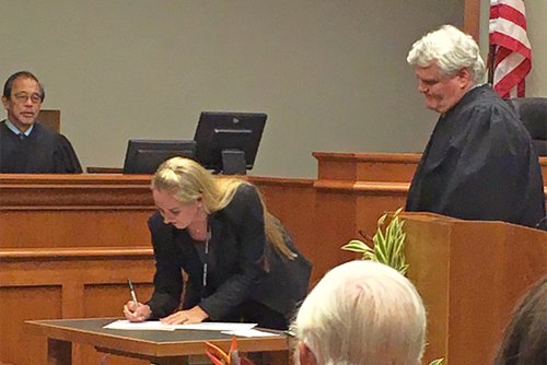 Judge Frenz signs the oath of office 10/31/2016.