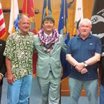 Third Circuit Chief Judge Ronald Ibarra (left), Veterans Treatment Court mentor, and supporters with the Big Island Veterans Treatment Court’s third graduate (middle).
