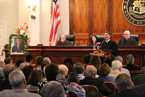 Intermediate Court of Appeals Chief Judge Craig H. Nakamura at the Supreme Court podium. At the bench, Associate Justice Richard Pollack, Associate Justice Paula A. Nakayama, and Chief Justice Mark E. Recktenwald.