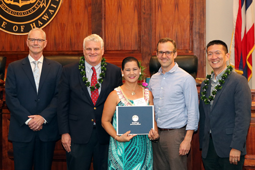 Group photograph of Raynette Ah Chong (center) receiving an award at the Hawaii Pro Bono Awards in 2017.