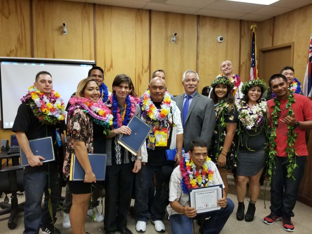 Kona Drug Court graduates celebrate their accomplishments with Judge Melvin Fujino.