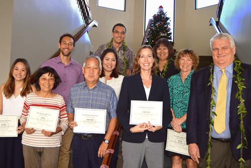 Photograph of Hawaii Chief Justice Mark E. Recktenwald congratulating volunteer attorneys in Kauai.