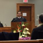 Photograph of Henry Nakamoto after Swearing in Ceremony speaking at podium
