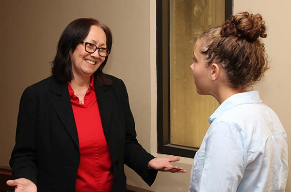 Photograph of Supreme Court Associate Justice being interviewed by a journalist student