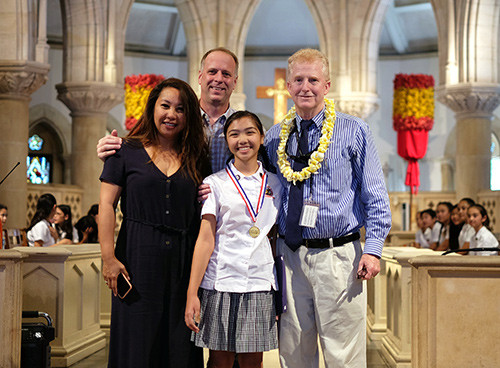 2019 First Circuit Law-Day Poster Contest first place winner Morgyn Bunton, her family and First Circuit Chief Judge R. Mark Browning.