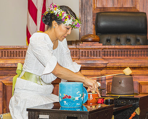 Photo: Charlyn Masini of Yushinkai performs the ritual tea ceremony, practiced in Japan since the 16th century. Photo courtesy of Wayne Muromoto.