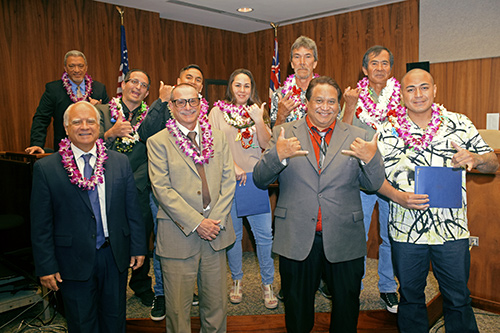 Attendees and special guests marked the 70th Maui Drug Court graduation at Hoapili Hale. From left, back row: Second Circuit Chief Judge Richard T. Bissen, Jr.; front row: Chief Judge Joseph E. Cardoza (ret.), Judge Peter T. Cahill, and Drug Court Substance Abuse Counselor IV George K. Aiwohi, Jr., with graduates.
