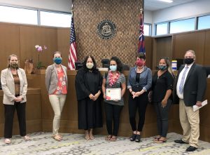 Photograph of court staff with the newest graduate of the Kona Jail Diversion Program 