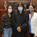 Kamahameha School sophomore Sami Ofisa, Fifth Circuit Court Judge Kathleen N.A. Watanabe, and Kamahameha School sophomore Xhayeani Camarillo stand together in front of the bench in Judge Watanabe’s courtroom, 2021.
