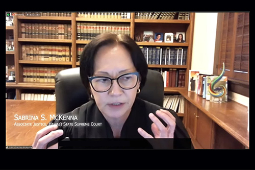 Hawaii Supreme Court Associate Justice Sabrina S. McKenna at her desk in chambers asking a question to one of the attorneys during oral argument, 12/01/2021.