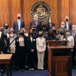 In the Hawaii Supreme Court Courtroom, Justices stand at the bench, as students and program mentors gather in front of the bench, 06/08/2022.