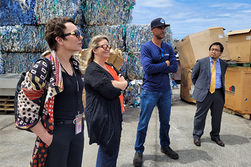 Judge Wendy DeWeese, Deputy Prosecutor Annaliese Wolf, and Deputy Public Defender Rick Macapinlac stand in front of large blocks of recycled material as they learn about the recycling process from Atlas Recycling Center Operations Manager Elias Allen, 05/02/2022.