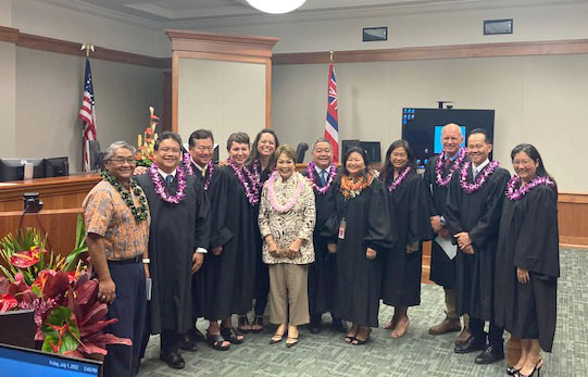 Image of legislators and judges at Jill Hasegawa's swearing-in ceremony.