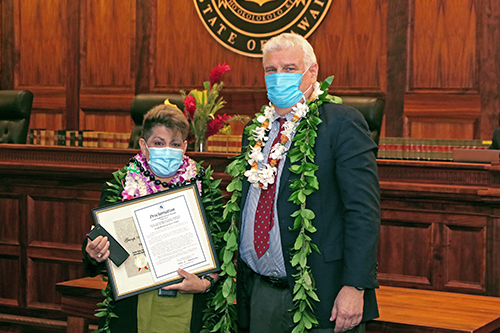 Jocelyn Soltren, District Court Clerk, Fifth Circuit (Kauai County) Court Support Services Section, with Hawaii Supreme Court Chief Justice Mark E. Recktenwald in front of the Supreme Court courtroom bench, 09/23/2022