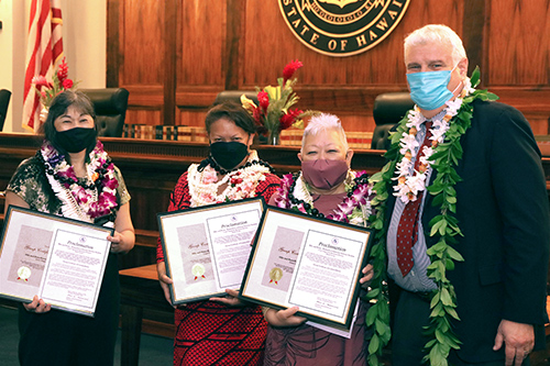 Third Circuit’s Hilo and Kona/Kamuela Courtroom Services Section Supervisors Marlene Kalua, Debra Reinking, and Lisa Ciriako join Hawaii Supreme Court Chief Justice Mark E. Recktenwald in front of the Supreme Court courtroom bench, 09/23/2022.