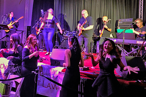 Band members of The Judicats perform on stage at Rock for Justice at Artistry Kakaako, 11/10/2022