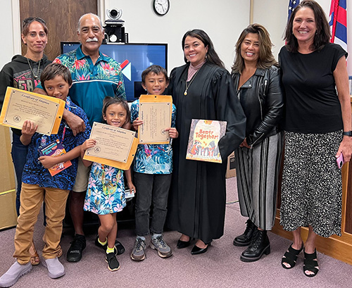 Image of Judge Adrianne Heely with Molokai family.