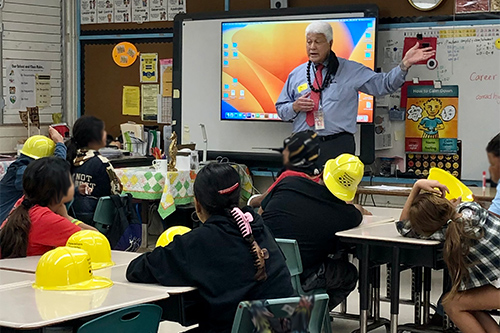 First Circuit District Court Judge Thomas Haia speaking in front of a classroom at Waiʻanae Elementary, 03/07/2023.