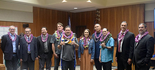 Image of: The proud graduates surrounded by, from left, Deputy Corporation Counsel Kenton Werk, Second Circuit Chief Judge Peter T. Cahill, Drug Court Judge Kelsey T. Kawano, District Court Judge Christopher M. Dunn, and Deputy Public Defender Gustavo Gonzalez.