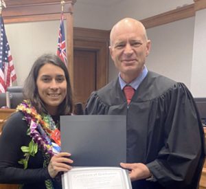 Image of Judge Jeffrey Hawk and Hilo Drug Court graduate.