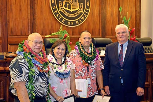 Administrative Director of the Courts Rodney Maile, Human Resources Manager Jennifer Ueki, Second Circuit Deputy Chief Court Administrator Ernest De Lima, and Hawaiʻi Supreme Court Chief Justice Mark Recktenwald.in front of the Hawaiʻi Supreme Court courtroom bench, 09/29/2023.