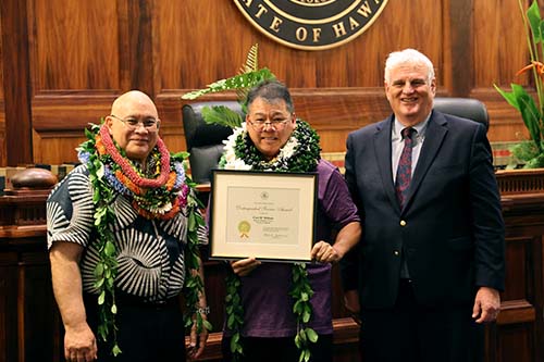 Administrative Director of the Courts Rodney Maile, Supreme Court Operations Officer / Bailiff Curt Shibata, and Hawaiʻi Supreme Court Chief Justice Mark Recktenwald in front of the Hawaiʻi Supreme Court courtroom bench, 09/29/2023.