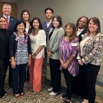 Standing together at the Child Sex Trafficking Roundtable, in Honolulu’s Ala Moana Hotel, July 2023: Front row left: Children’s Justice Centers of Hawaiʻi Statewide Director Jasmine Mau-Mukai, Maui Forensic Interview Specialist Deashia Chang, State Rep. Linda Ichiyama, Kauaʻi Children’s Justice Center Director Karla Huerta, Oʻahu Children’s Justice Center Director Bethany Stetson, East Hawaiʻi Children’s Justice Center Director Terri Lum, Oʻahu Forensic Interview Specialist Valerie Diaz, and National Criminal Justice Training Center (NCJTC) faculty member Byron Fassett. Back row left: Maui Children’s Justice Center Director Jackie Cockett, NCJTC faculty member Richard Love, NCJTC Executive Director Brad Russ, Kauaʻi Forensic Interview Specialist Kelcie Morita, West Hawaiʻi Children’s Justice Center Director David Okumura, East Hawaiʻi Forensic Interview Specialist Nikkole Drake-Clark.