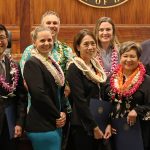 Hawaiʻi Supreme Court Associate Justice Todd Eddins, attorneys Daniel Kawamoto, Maile Osika, Zachary McNish, Lily Ling, Madisson Heinze, Marie Laderta, and Chief Justice Mark Recktenwald standing together in front of the Hawaiʻi Supreme Court courtroom bench at the Hawaiʻi Access to Justice Commission's 2023 Pro Bono Celebration, 10/26/2023.