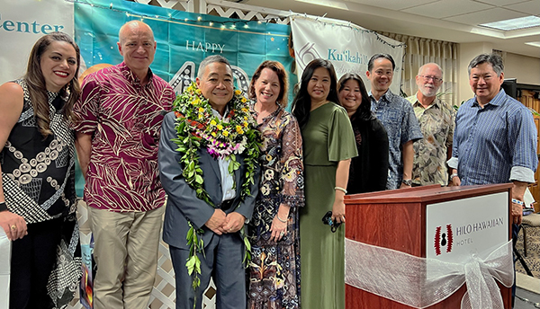 Image of Chief Judge Kim being congratulated by his Third Circuit colleagues, from left, Judges Kanani Laubach, Jeffrey Hawk, Mahilani Hiatt (ret.), Darien Ching Nagata, Jill Hasegawa, Jeffrey Ng, Bruce Larson (per diem), and Peter Kubota.