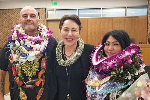 Two Big Island Drug Court graduates stand with Judge Wendy DeWeese in a courtroom, Keahuolū Courthouse, Kailua-Kona, Hawaii, 10-23, 2023.