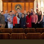 Attorneys and Judiciary staff who provided support for the Honolulu District Court Access to Justice Room stand together at the front of the Hawaii Supreme Court courtroom, 12/12/2023.