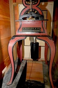 Aliʻiōlani Hale clock tower central mechanism, showing the manufacturer plate: "E. Howard & Co., Boston, Mass."