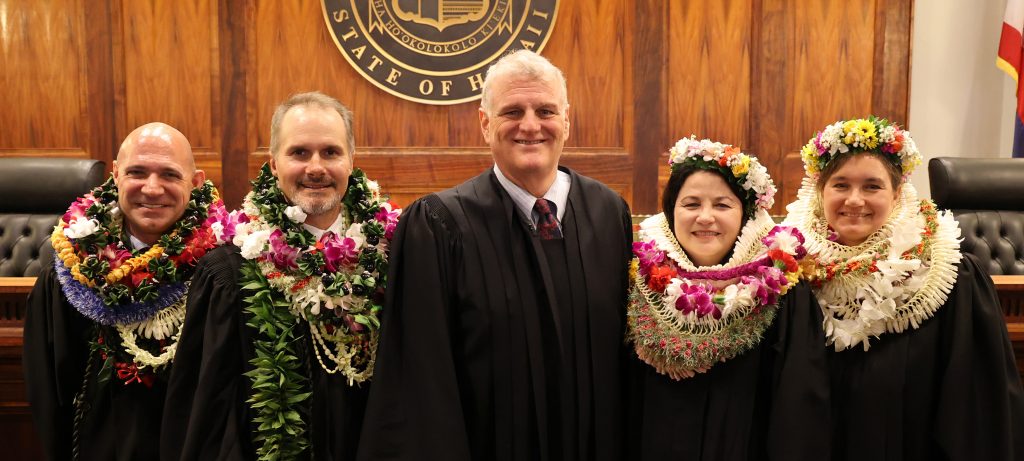 Image of Chief Justice Mark Recktenwald (center) congratulates, from left, Judge Brian Costa, Judge Steven Nichols, Judge Dyan Medeiros, and Judge Rebecca Copeland after they were sworn in as Circuit Court Judges of the First Circuit (Oʻahu).