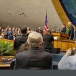 Attendees give a standing ovation for Hawaiʻi Supreme Court Chief Justice Mark E. Recktenwald, who stands at the Senate Chamber rostrum in the State Capitol, January 23, 2025.