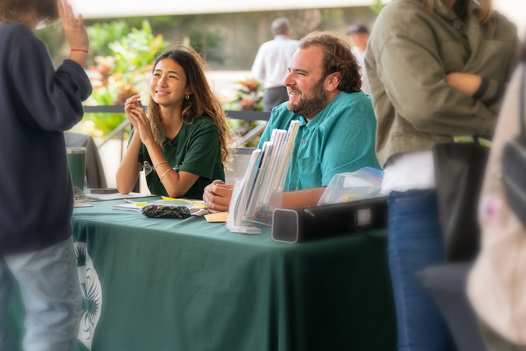 College intern Arisa Moore and attorney Ethan Rabinowitz from Volunteer Legal Services Hawaiʻi engage with attendees and answer questions at their booth during the Service Fair.