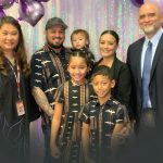 Posing for a photo are Judge Darien Ching Nagata, the Kawakami family, and Guardian Ad Litem Martin Bento on Adoption Day.