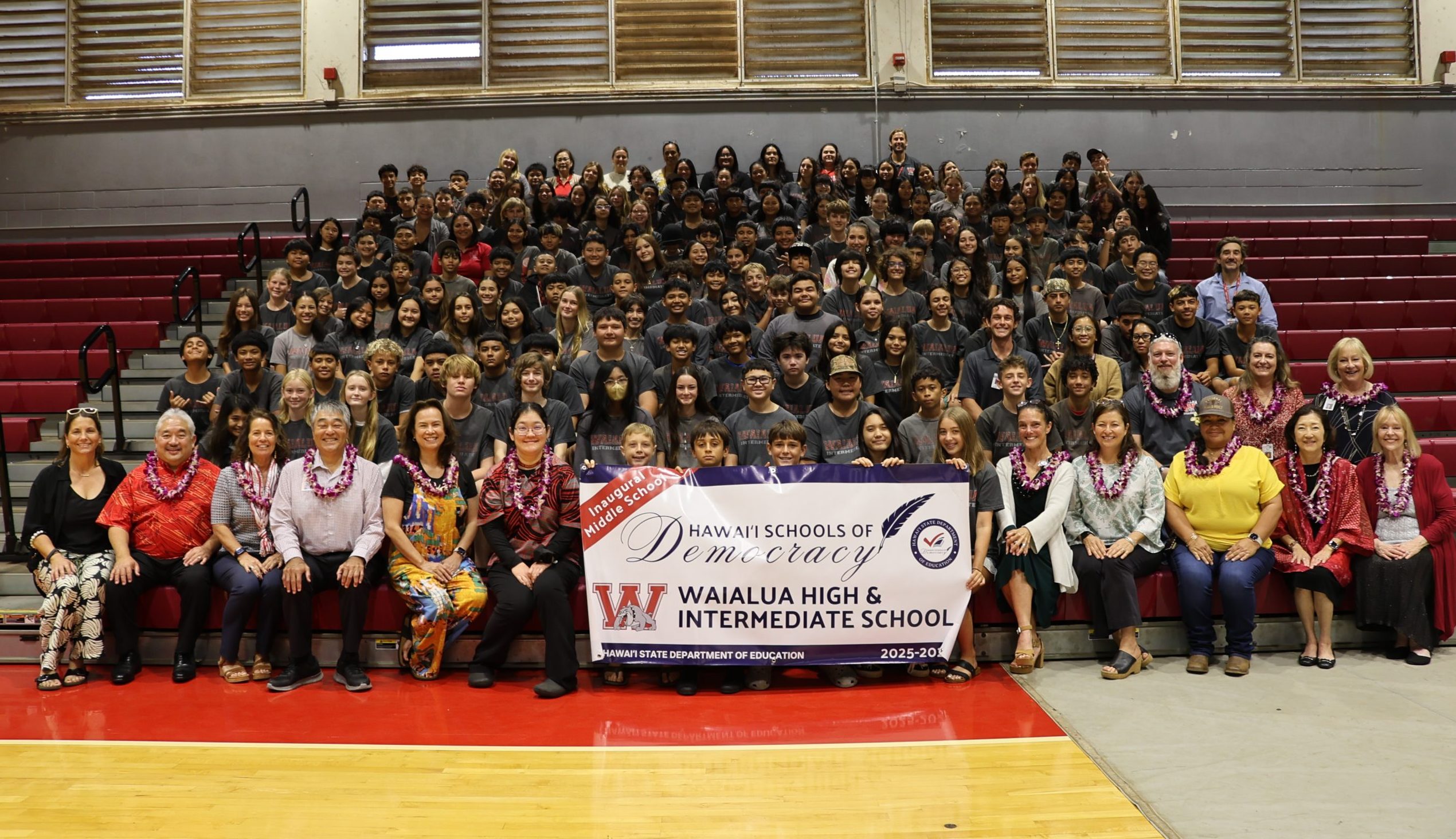 Waialua High & Intermediate School students, teachers, and staff pose with DOE personnel and state officials after being named a Hawai'i School of Democracy. Photo courtesy of the Hawai'i Department of Education