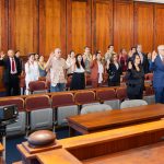 Attorneys stand with their right hand raised in the Hawaiʻi Supreme Court courtroom on Law Day, May 1, 2025, as they reaffirm their oath to support and defend the Constitution of the United States and the Constitution and laws of the State of Hawaiʻi.