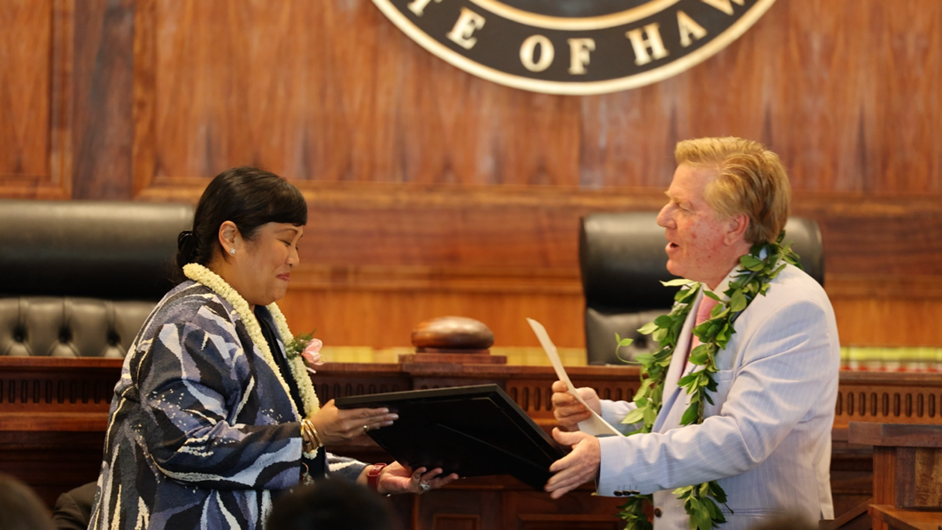Associate Justice Todd Eddins presents Judge Clarissa Malinao with a proclamation from Chief Justice Vladimir Devens during the Drug Court graduation on May 15, 2026.