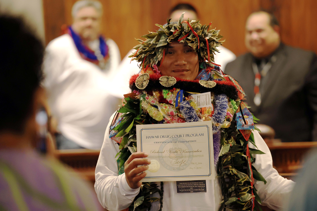 Richard Keli'i Kaanoi-Ruben poses with his Drug Court certificate in the Supreme Court courtroom at Aliʻiōlani Hale on May 15, 2026.