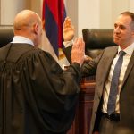 Chief Justice Vladimir P. Devens administers the oath of office to Associate Judge Daniel M. Gluck during the ceremonial swearing-in.