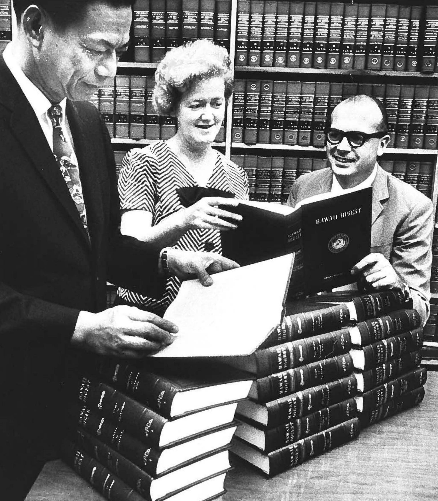 Former Hawaiʻi Supreme Court Chief Justice William S. Richardson, State Law Librarian Margaret Setliff, and Administrative Director of the Courts Lester Cingcade in the Hawaiʻi Supreme Court Law Library in 1967.
